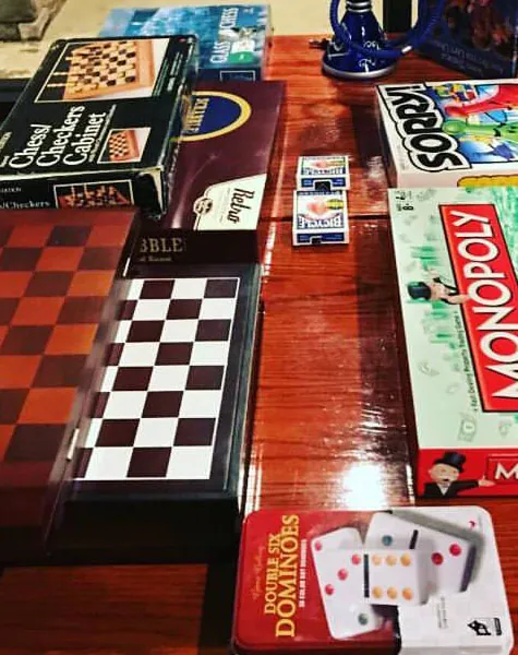 Board games stacked on a Haze table
